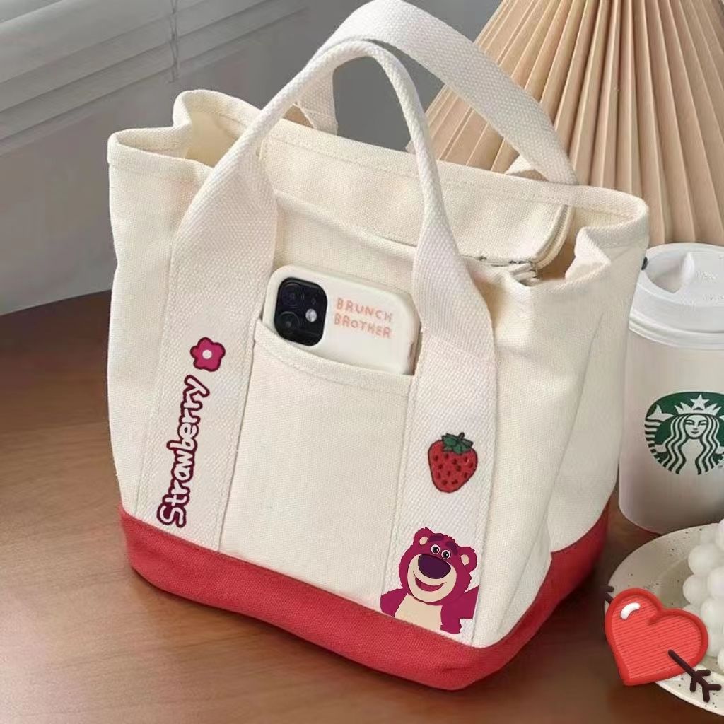A small handbag is carried by a female student going out. She is carrying a 2024 new style bag, a mini canvas bag, and a Korean version bento bag for female students Specification drawing