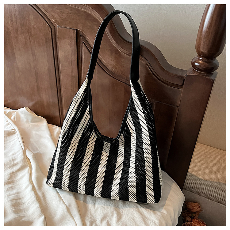 Korean summer new striped woven bag, casual vacation and laid-back style tote bag, hand and shoulder commuter tote bag undefined