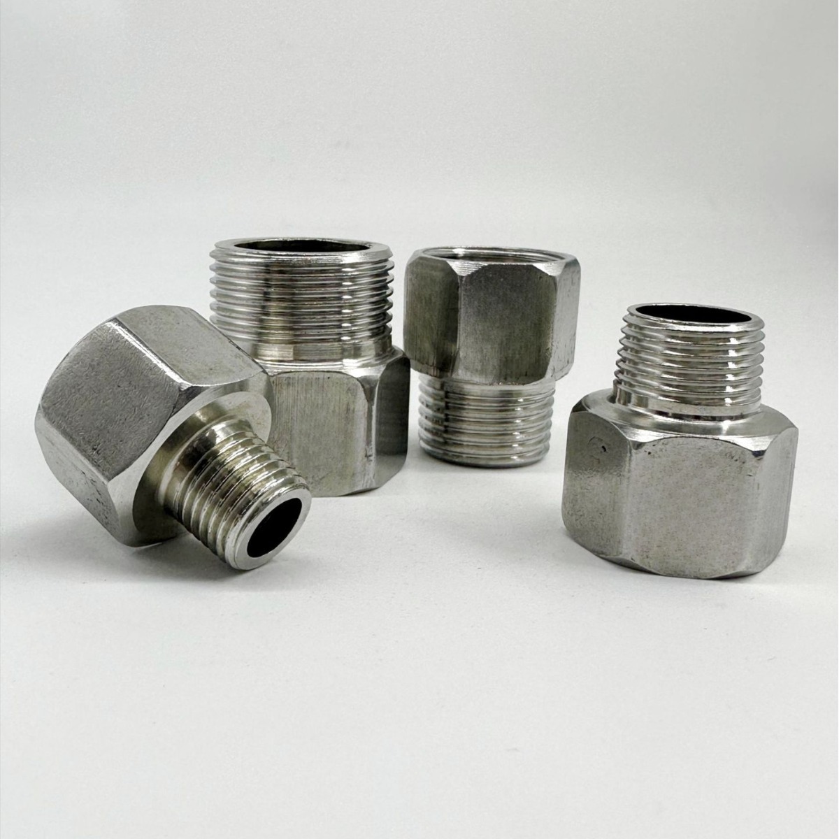 304 acero inoxidable interior y exterior tamaño reducido cabeza de diente interno a diente externo junta de diente hexagonal reductor de rosca directa