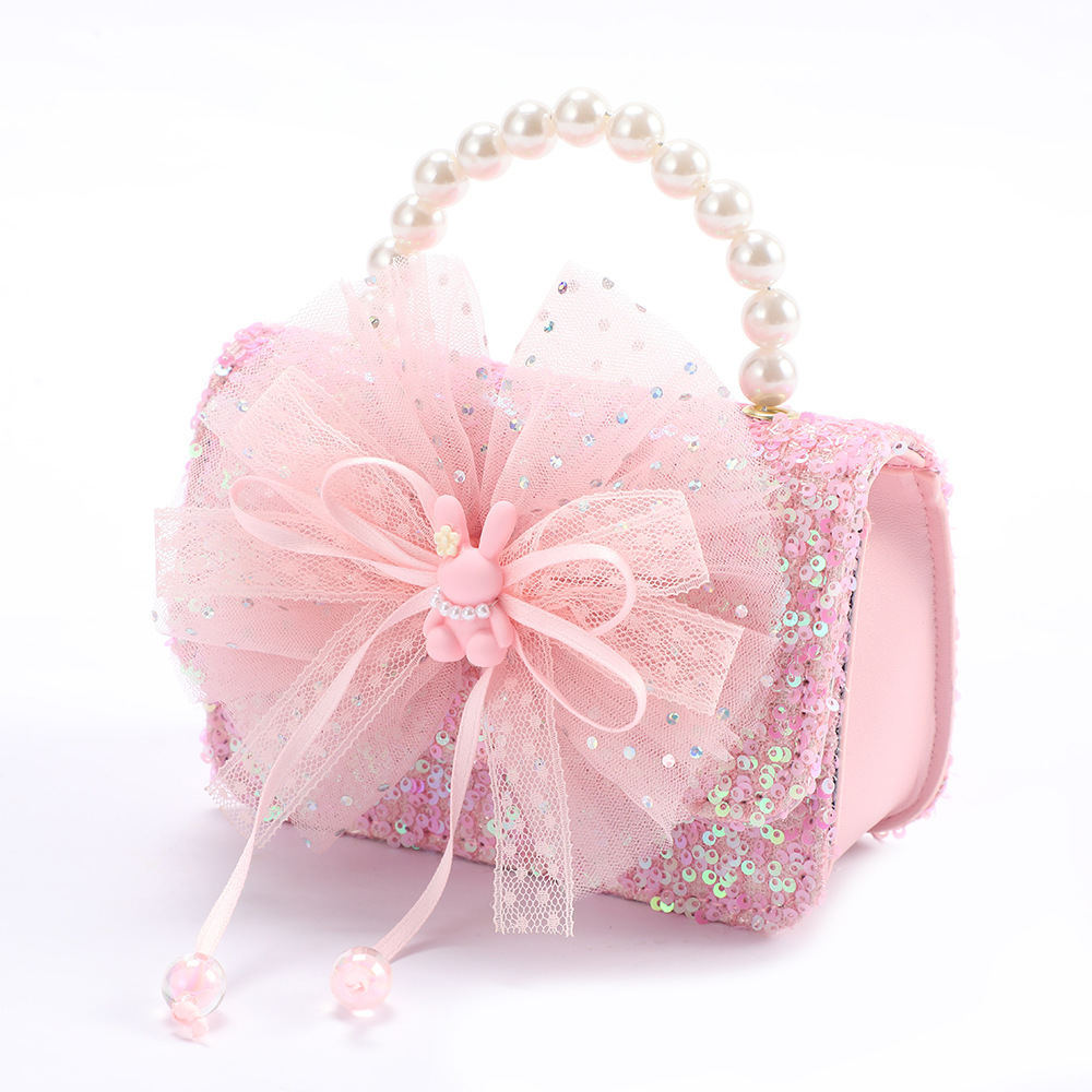 Monedero infantil con lazo, mochila pequeña, bolso bandolera de dibujos animados My Melody para niña, lentejuelas que reducen el peso