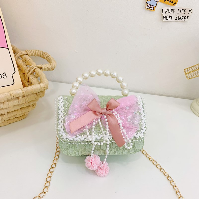 Otoño y invierno coreano arco camellia bolsas de niños de encaje de mano perlas bolsas mochilas para niñas de jardín de infantes