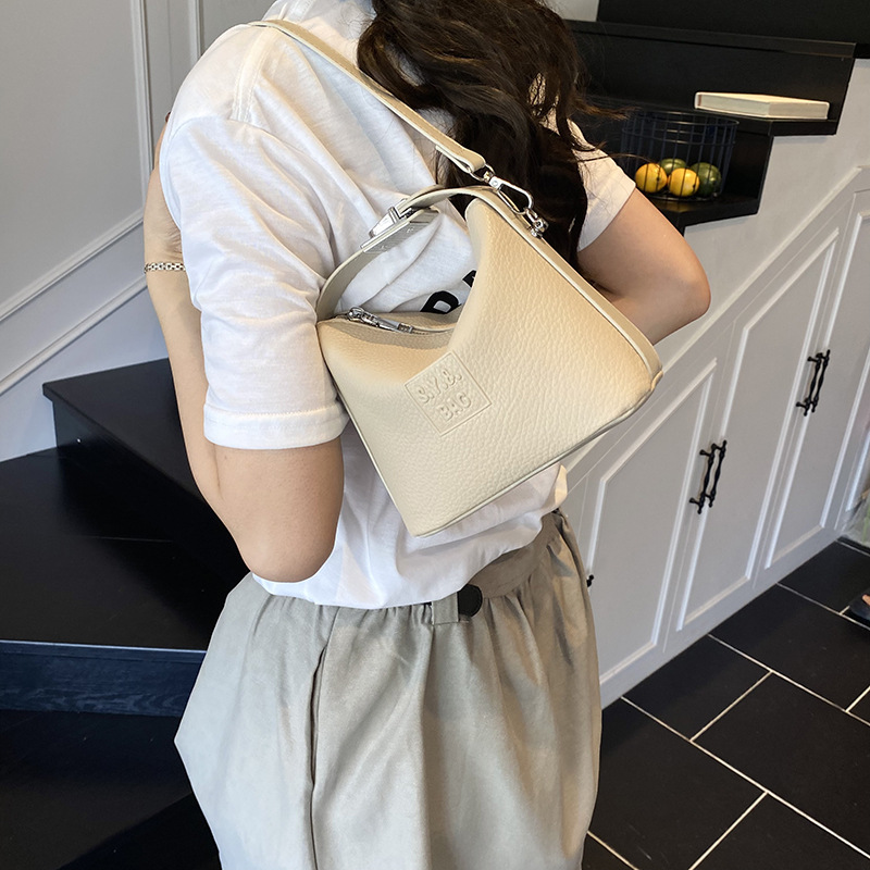 Bolso de moda coreano 2025 verano nuevo bolso femenino retro litchi patrón bandolera simple letra bandolera