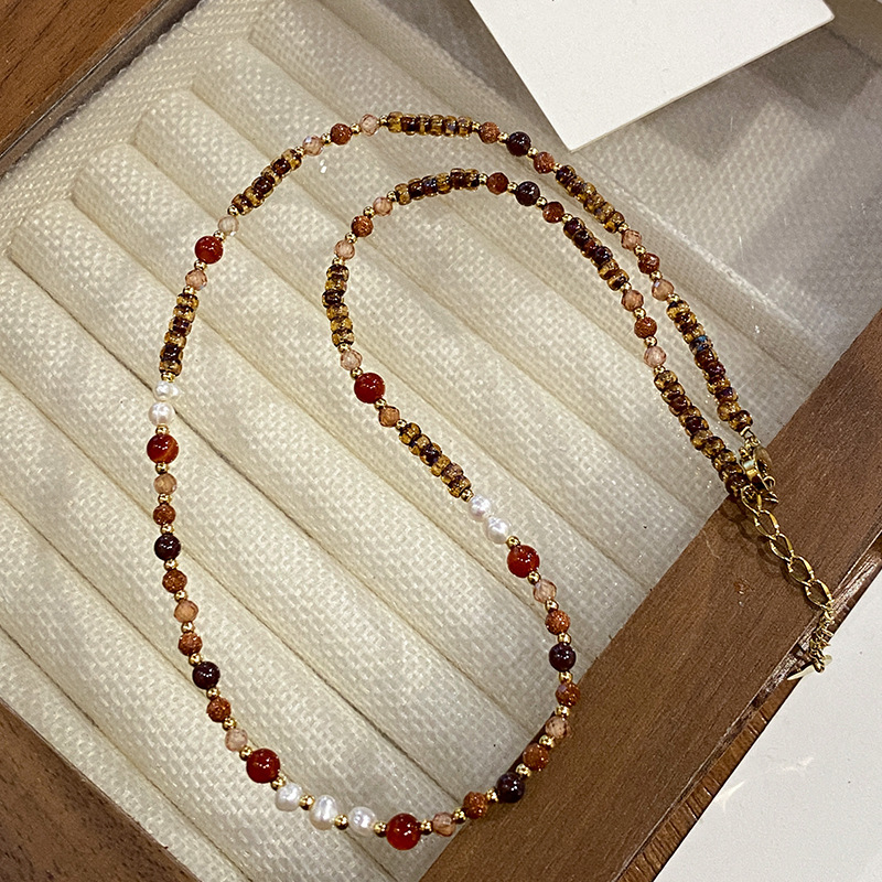 Collar con cuentas de ojo de tigre Maillard Cadena de suéter de otoño e invierno de alta calidad Acero de titanio Cadena de clavícula de piedra natural retro de lujo ligero