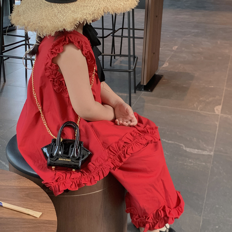 Bolso de hombro para niños y niñas de estilo coreano Bolso de mensajero para niños de color sólido de charol láser fresco de moda Bolso para niños de comercio exterior de cadena nueva