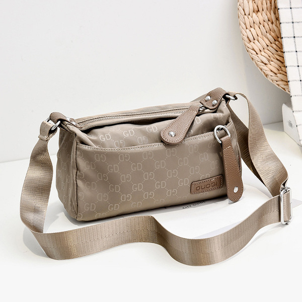 Cross-border wholesale 2026 new women's bags, fashionable waterproof shoulder crossbody bag, trendy nylon Oxford cloth shoulder bag, cylindrical bag