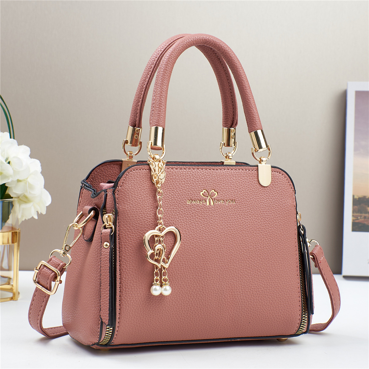 Bolso de mano de explosión bolso de mujer 2025 fabricante de comercio exterior nuevo bolso de hombro de verano atmósfera de moda universal