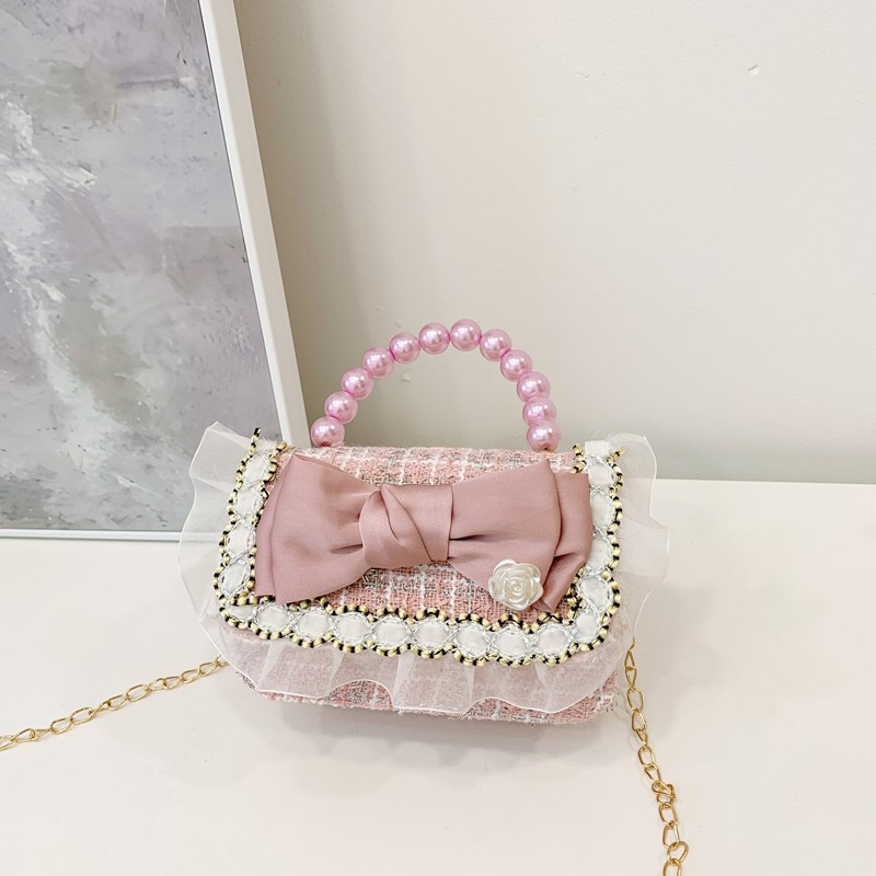Bolsa de hombro coreana para niñas, arco de perlas, lindas flores, bolso de mochila para bebés, nuevo tipo de bolso para niños fragante.