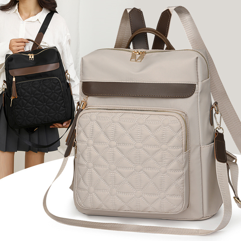 Mochila de nailon multifuncional para mujer 2024 nuevo estilo casual mochila de viaje de viaje línea de bordado de moda mochila escolar de gran capacidad