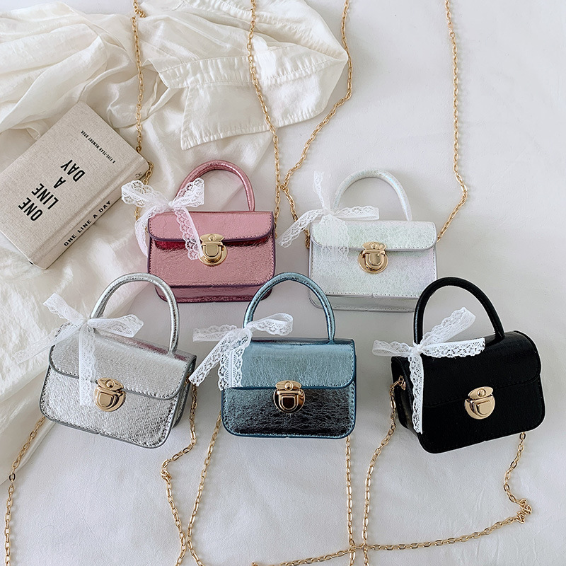 2026 bolso de niña pequeña mini bolso de cadena simple de color sólido bolso coreano nuevo bolso de cambio para niños