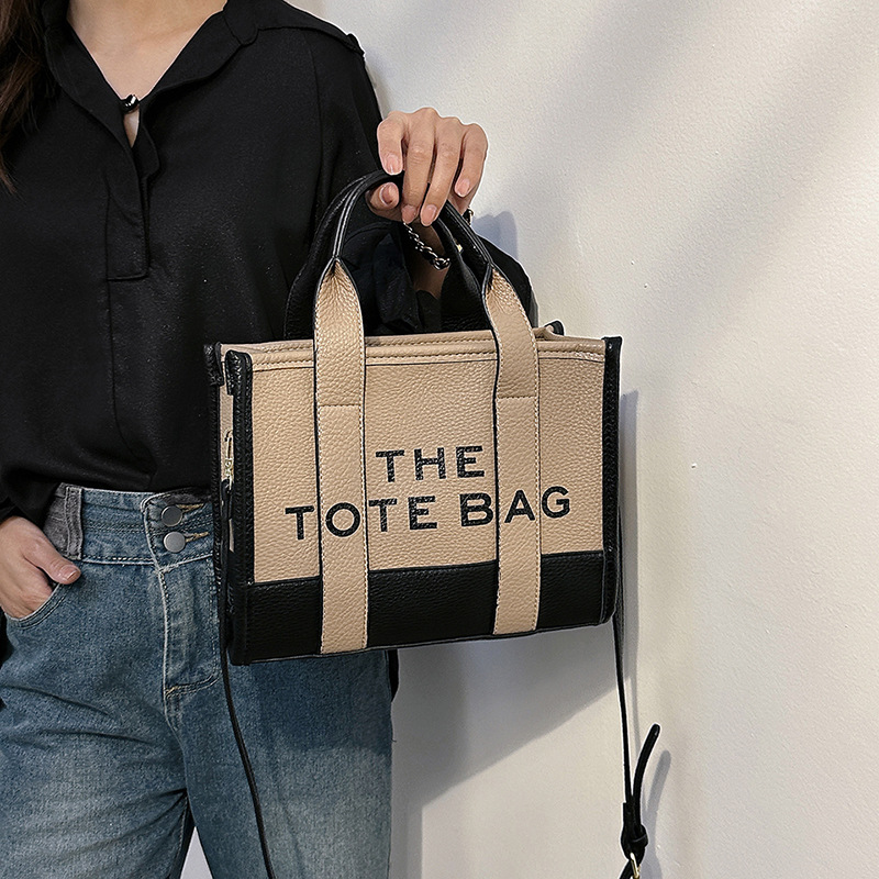 Bolso tote de comercio exterior para mujer 2023, nuevo bolso de mano moderno europeo y americano, bolso bandolera con estampado de letras y bloques de color.