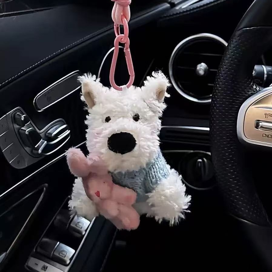 파란색 스웨터를 안고 있는 토끼 스타일