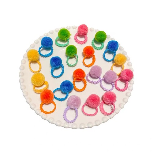 Cute little hair ties with fluffy balls for kids, perfect for girls—adorable, colorful elastic bands to style adorable braids for babies and toddlers.