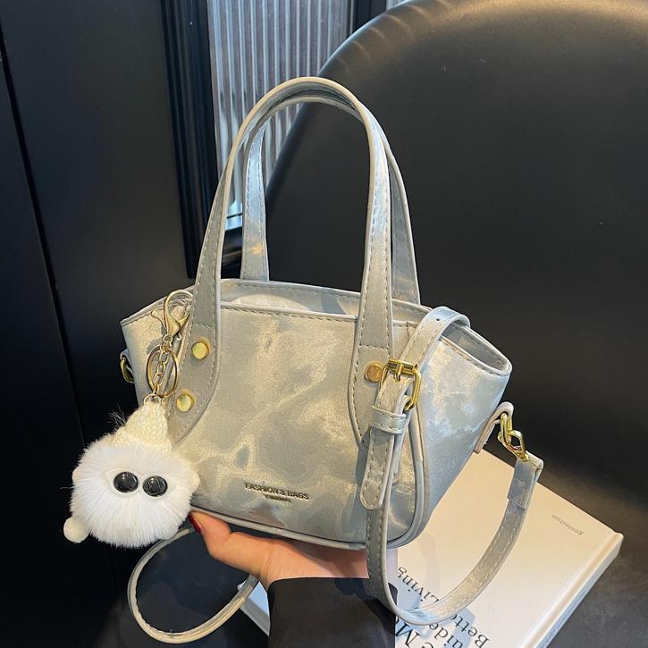 Nicho de diseño de tendencia bolso de cubo de mano mujer 2025 nueva moda bolso de hombro de estilo extranjero para trabajar bolso de transporte