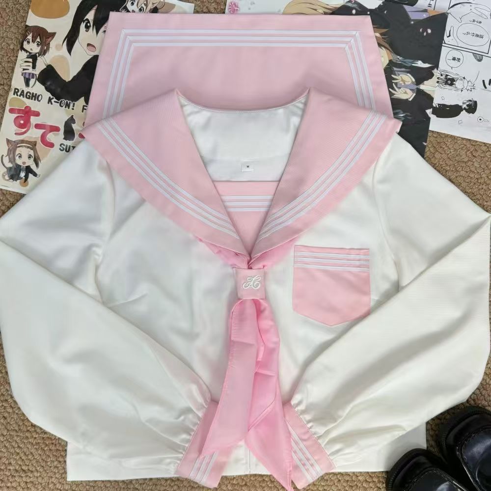 Japanese-style sweet sailor uniform with a pink collar, white trim, and a classic, preppy, and youthful look; a pink and white JK uniform set with a pleated skirt