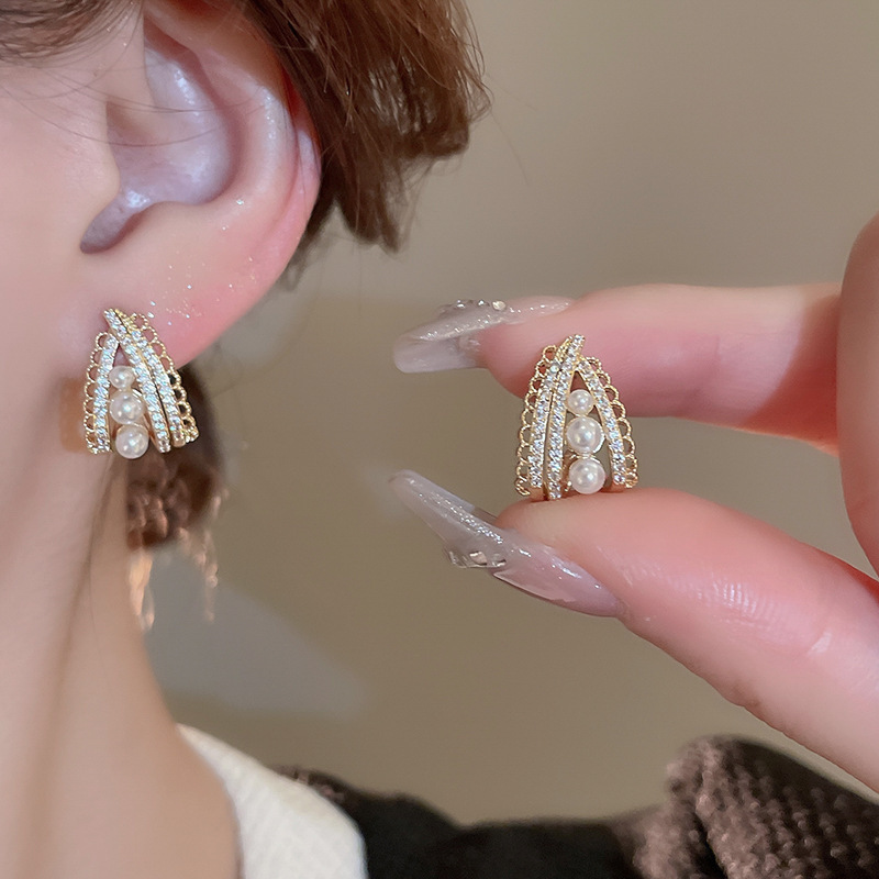 Pendientes de perlas de flor de circón de aguja de plata, pendientes de lujo de alta gama de lujo ligero exquisito, pendientes de todo fósforo blanco de moda de nicho al por mayor