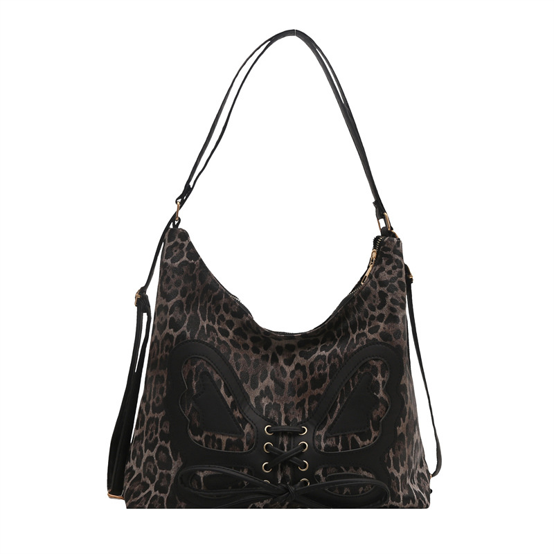 Mochila de arco de gran capacidad para mujeres 2025 primavera nueva mochila retro textura de viaje elegante bolsa de mano