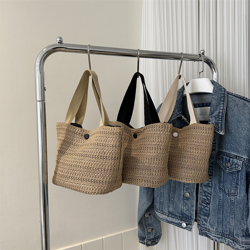 Paja tejida de gran capacidad temperamento bolsas de mano de verano 2024 nueva bolsa de ocio de estilo extranjero este año popular bolsas de cubo de hombro