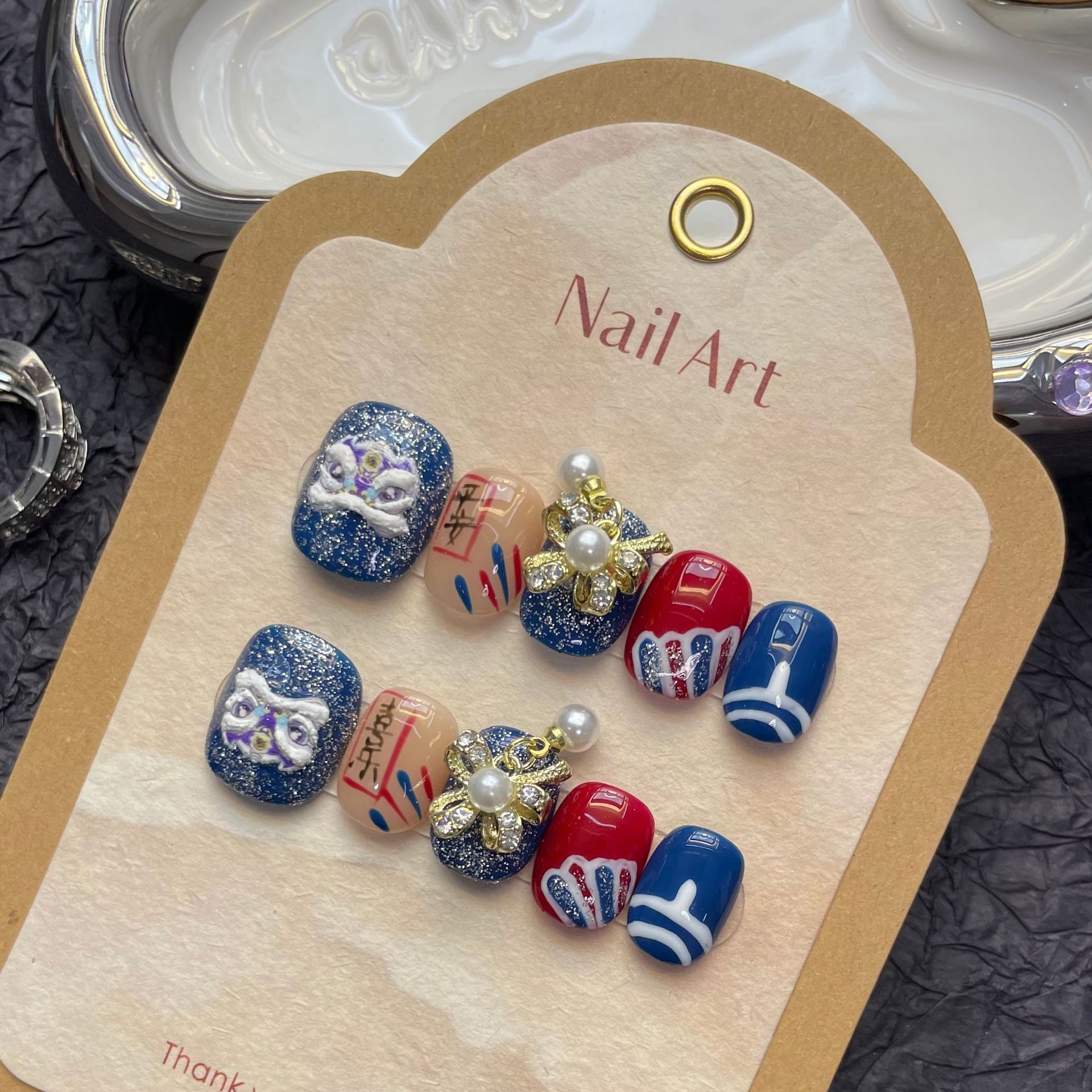 Hecho a mano desgaste de uñas ojo gato Xingshi seguro feliz perla colgante festivo Blanco Primavera Festival manicura al por mayor