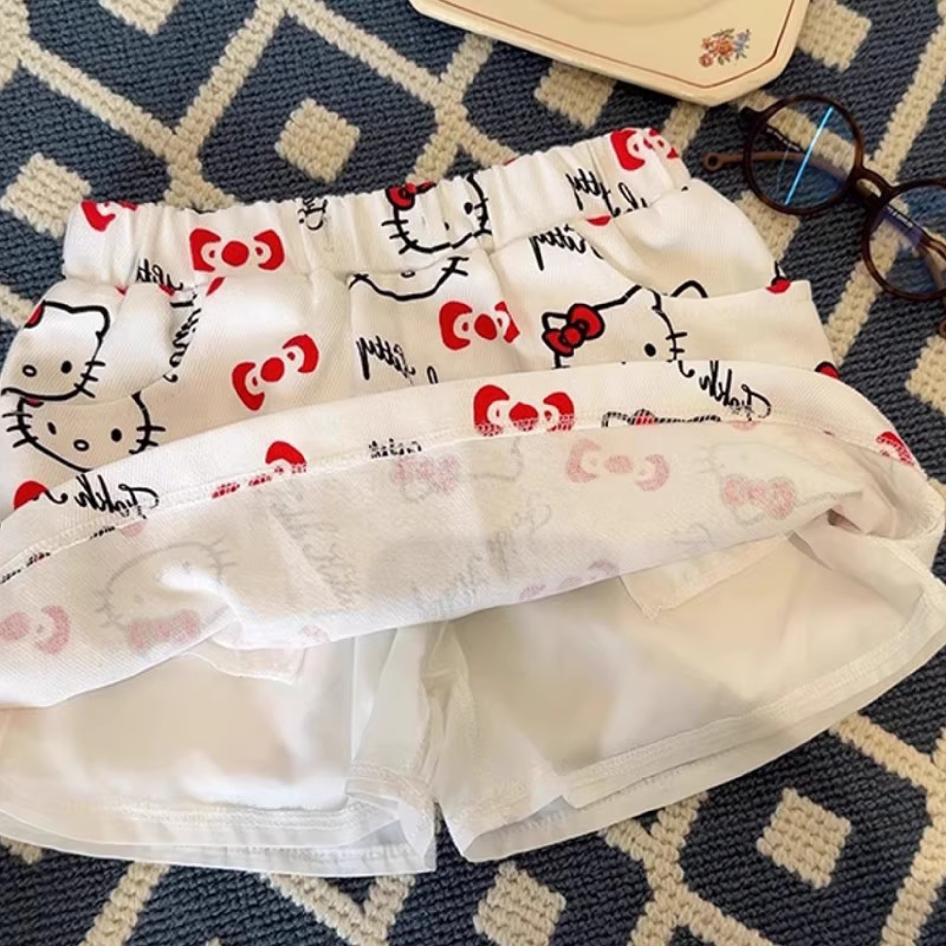 Xianning siete niñas nueva falda corta tesoro femenino verano impresión completa KT gato falda de dibujos animados salvaje estilo occidental red de Internet ropa para niños