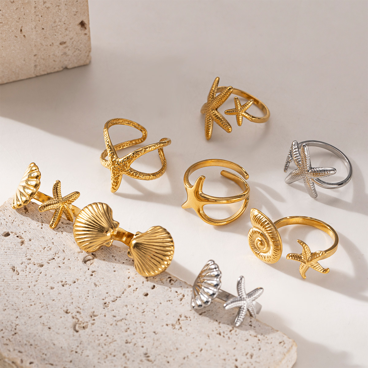 Anillo de acero inoxidable europeo y americano Taina, lujo ligero, sentido de alta gama, vacaciones en el océano, anillo de concha de estrella de mar de playa, diseño de todo fósforo