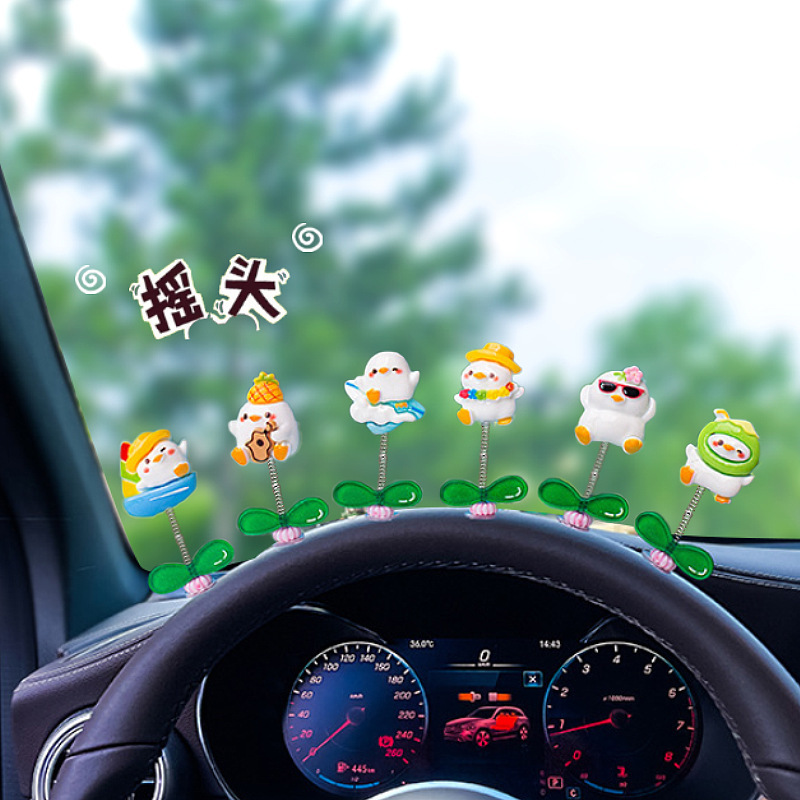 Dibujos animados creativos Consola central de pato lindo Adornos de coche Muñeca de pato pequeño Decoración de escritorio de coche Artículos de decoración