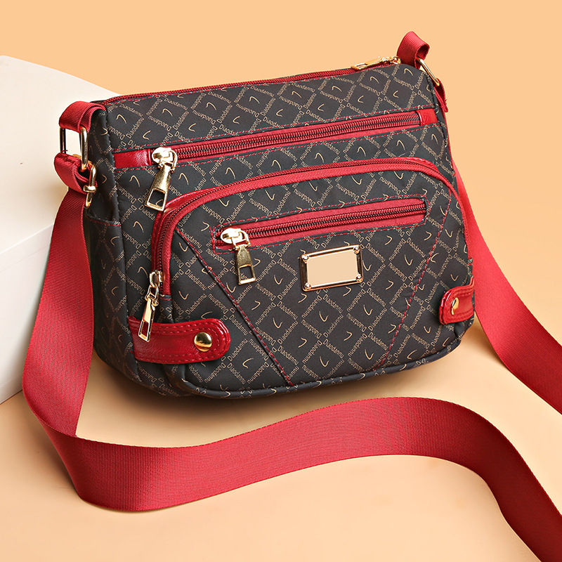 Borsa da donna 2023 Nuovo modello per anziani, borsa piccola stampata elegante di alta gamma, borsa a tracolla per donne di mezza età e_voghion.com