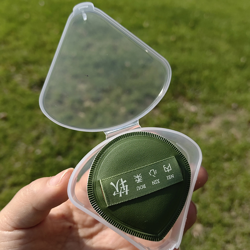 Puff polvo húmedo y seco de algodón de azúcar colchón de aire soplo de polvo al por mayor esponja de maquillaje superficie de cuero triángulo caja de almacenamiento de soplo de polvo