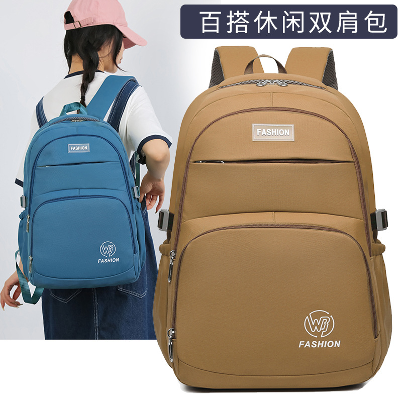 Al por mayor nueva mochila simple, mochila de viaje casual de moda, mochila de gran capacidad para estudiantes de primaria y secundaria para reducir la carga