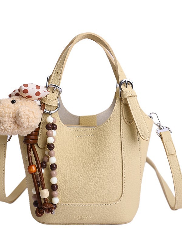 2026 nueva moda versátil cesta de verduras portátil bolso de cubo de agua de alta calidad litchi patrón ligero bolso de lujo bolso de mochila