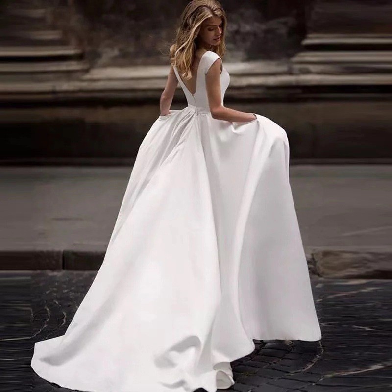 Europa y los Estados Unidos comercio exterior vestido de boda verano 2026 nueva novia de cola sexy delgada satén simple moda de viaje