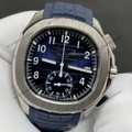 Blue dial white hands silver case blue strap