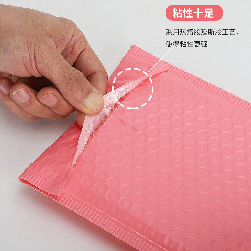 Bolsa de burbujas de película de coextrusión rosa Bolsa de embalaje de logística de ropa al por mayor Bolsa de embalaje exprés engrosada Bolsa de espuma Bolsa autoadhesiva