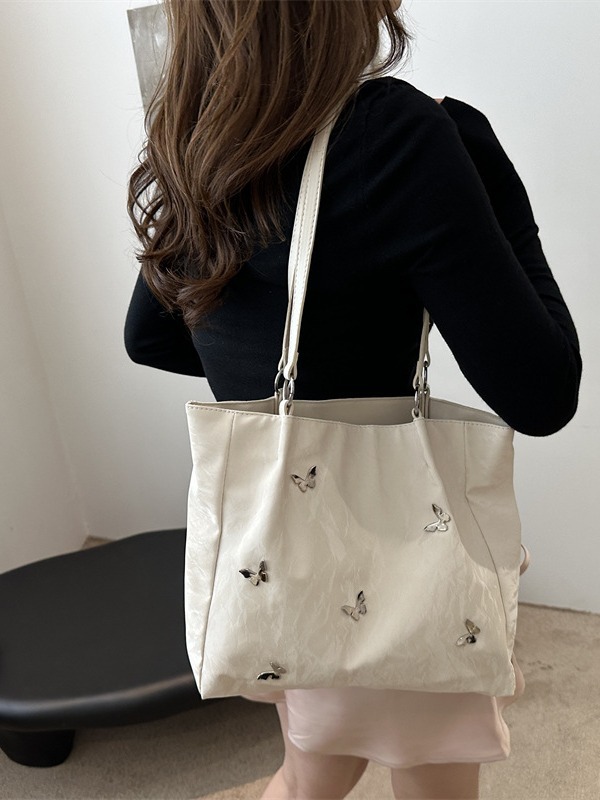 Bolsos de cubo de arco de alta calidad para mujeres 2024 verano nuevo estilo extranjero nicho bolso de hombro de moda bolso de mujer