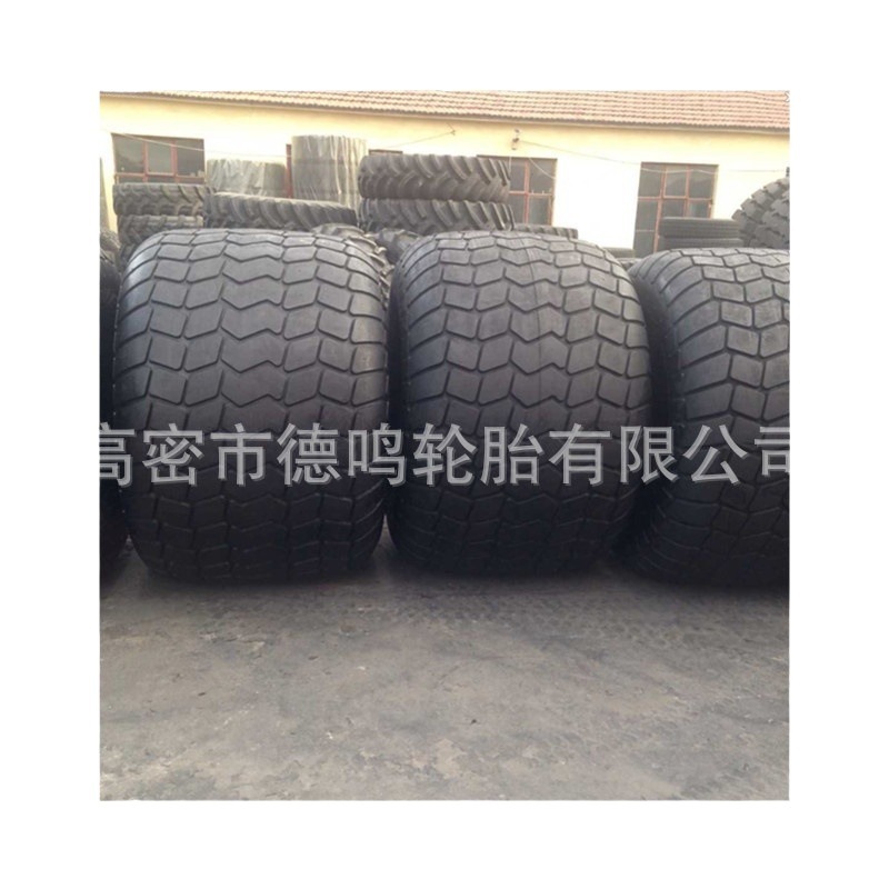 Suministro de neumáticos de ingeniería de forma especial 66x44-25 neumático de base ancha anti-hundimiento