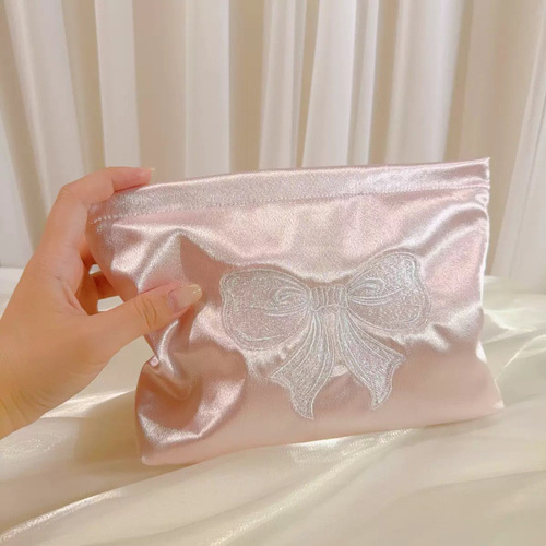 Fresh embroidered bow portable cosmetic bag, portable large-capacity liner storage bag, niche cloth
