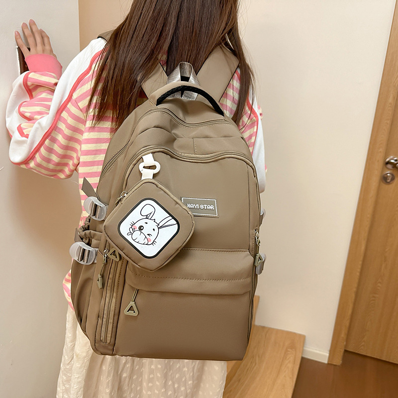 Mochila de estudiantes de moda simple 2025 nueva mochila casual de color sólido mochila de viaje de gran capacidad soporte personalizado