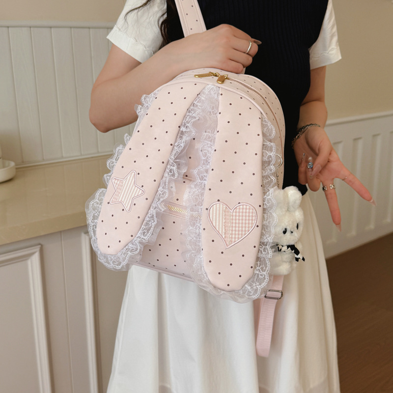 2026 nuevo punto de onda oreja de conejo mochila de moda mujer bolso de hombro universal portátil ligero bolso de encaje dulce