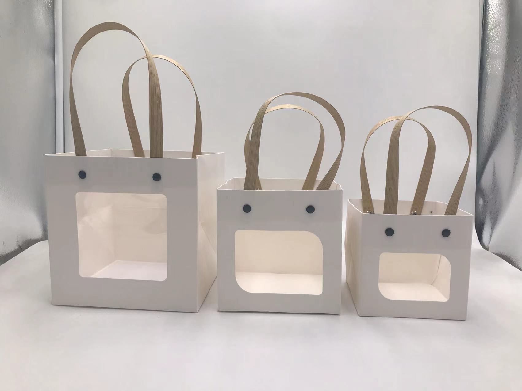 Bolso de mano con remache sonriente con ventana abierta transparente, caja de regalo de embalaje de vacaciones, joyería de juguete exquisita, bolsa de embalaje de plantas verdes al por mayor