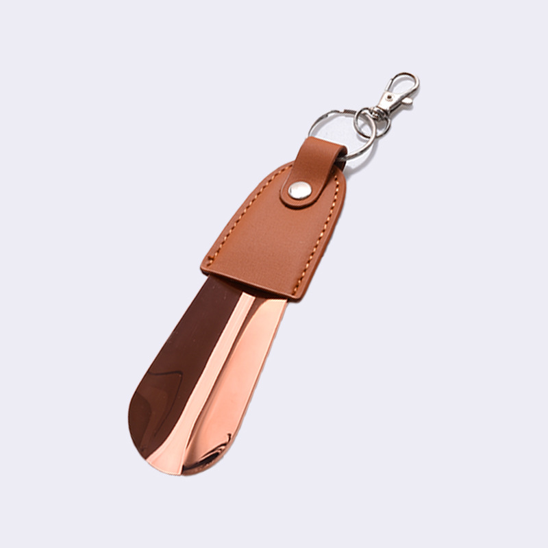 En stock suministro de acero inoxidable hebilla de llave tirador de zapatos con cubierta de cuero tirador de zapatos llave del coche colgante fácil de llevar levantador de zapatos