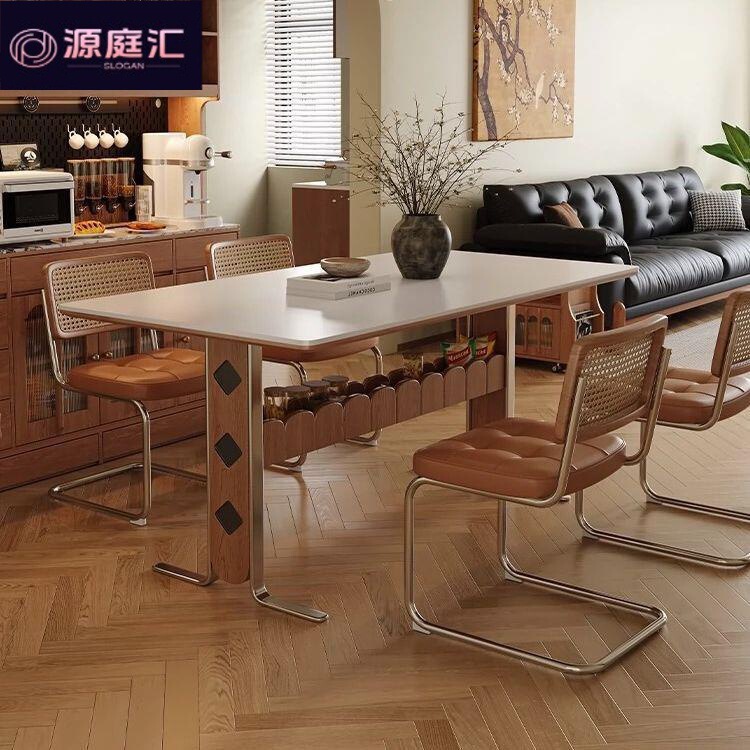 Vintage-style dining table with creative artistic curved metal legs, solid wood and rock slab, high aesthetic value, light luxury dining table for home use