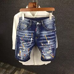 日本系の重ポンドは墨をかけてペンキを塗って古い穴のカウボーイの5分のズボンの男の直筒の乞食の半ズボンの復古の中でズボンを作ります。