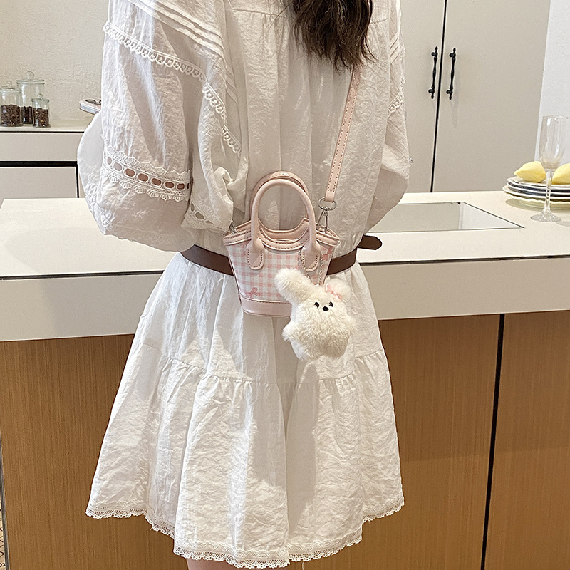 Nuevo tipo de bolso para niños, estilo coreano de moda, bolso de cubo a rejilla, mini bolso de hombro lindo para hombres y mujeres.