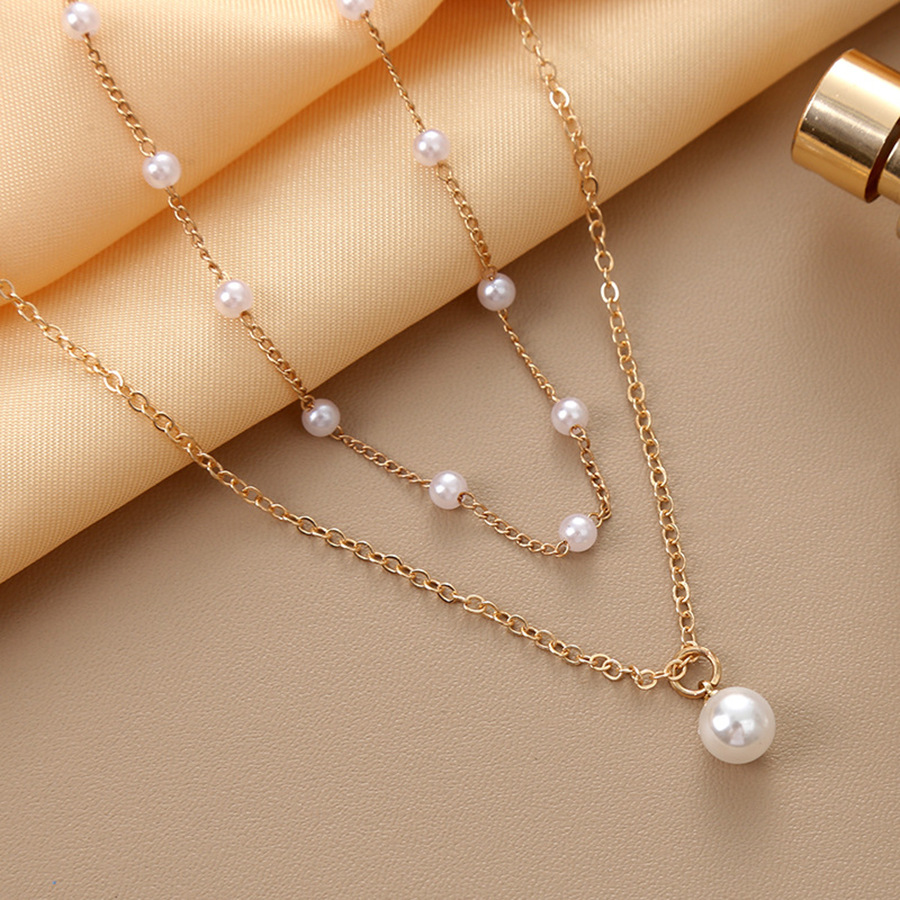 Collana con pendente di perle a strati per donna elegante_voghion.com