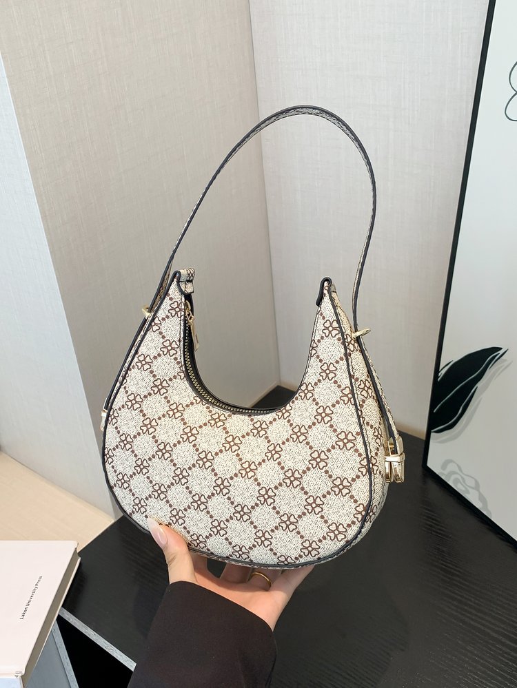 Exquisita moda con estampado de leopardo 2024 nuevo estilo estilo occidental patrón de cebra personalidad textura tendencia mensajero portátil bolso de luna nueva mujer