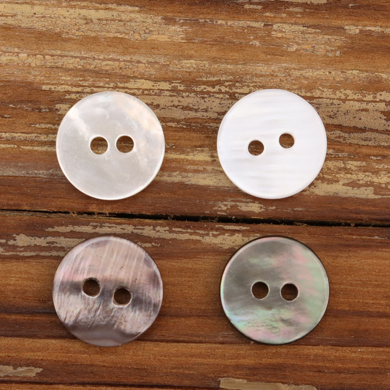 Two-eye flat shell button high-end fabric silk Hebei black silk white butterfly double-sided polished baked gray button Two-eye flat shell button high-end fabric silk Hebei black silk white butterfly double-sided polished baked gray button