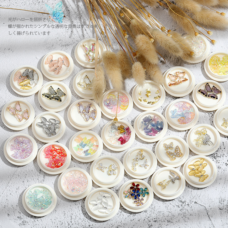 Online popular hielo transparente Aurora mariposa joyería cristal blanco piedra tridimensional uñas diamante Super Flash rhinestone uñas joyería