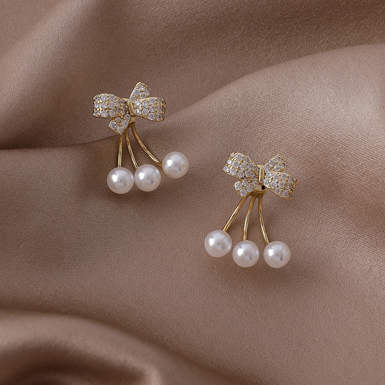 Vente En Gros Boucles D&#39;oreilles En Cuivre Perle Bowknot Zircon Micro-incrusté Nihaojewelry display picture 1