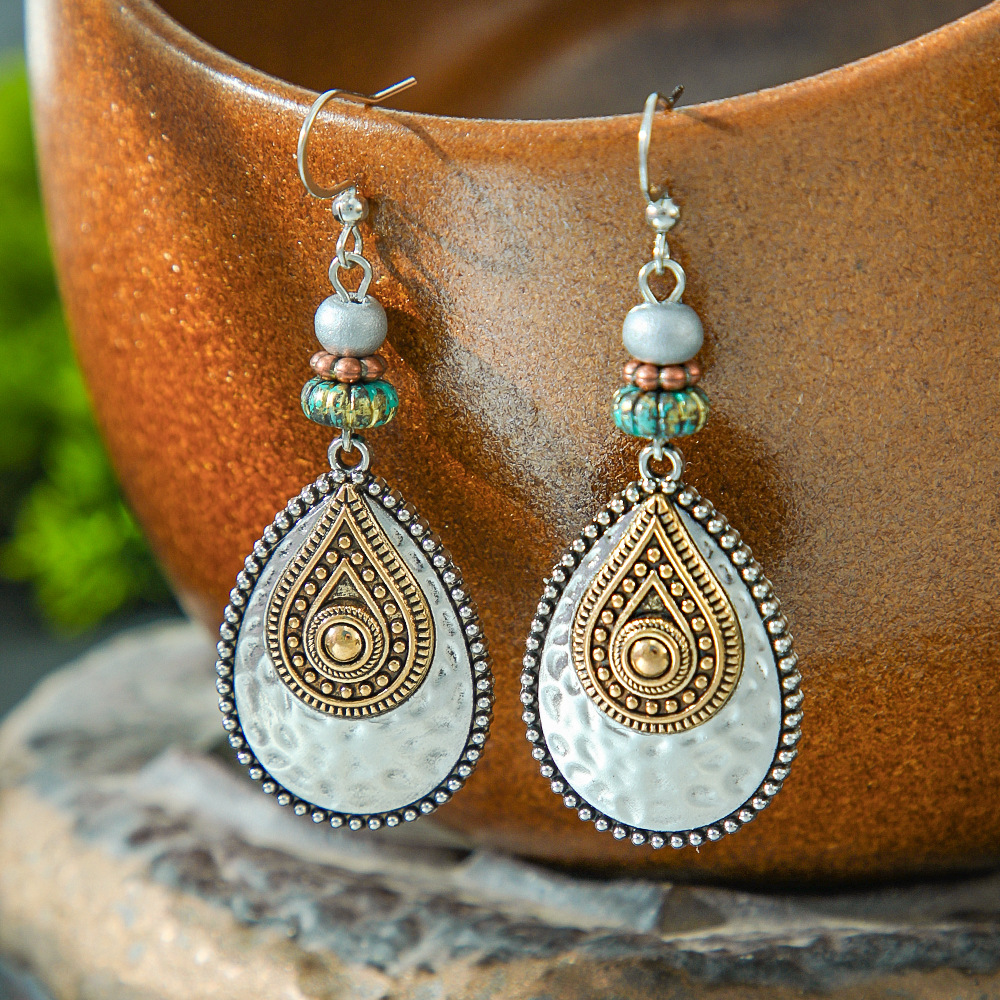 Ethnic golden water drop-shaped