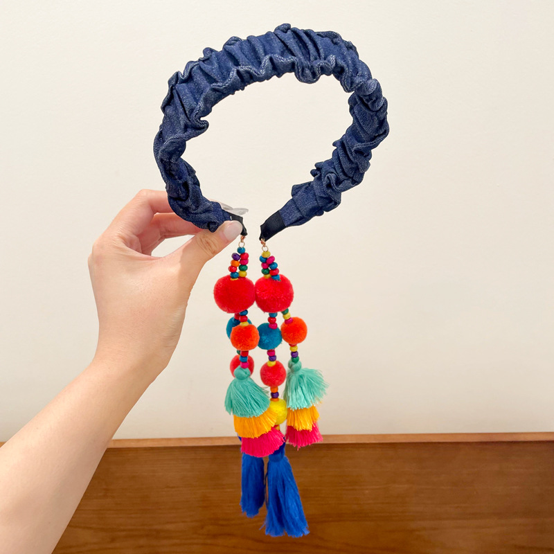 Dark blue pleated ball tassel headband