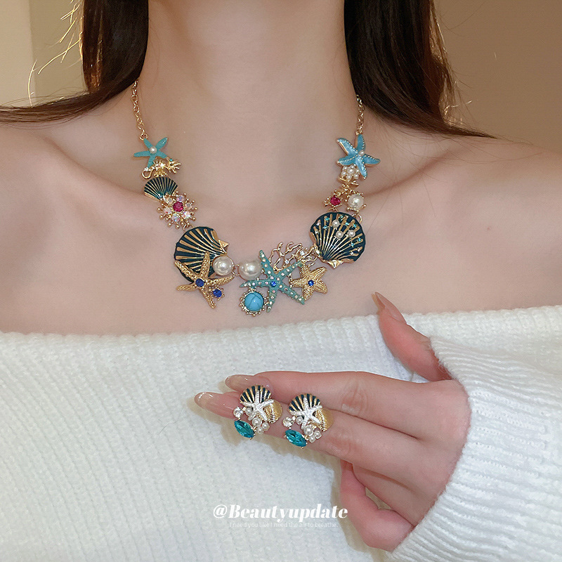 Collar de pendientes de coral de concha de estrella de mar goteando aceite, cadena de clavícula de todo fósforo de moda europea y americana, traje de nicho, lujo ligero, sentido de alta gama